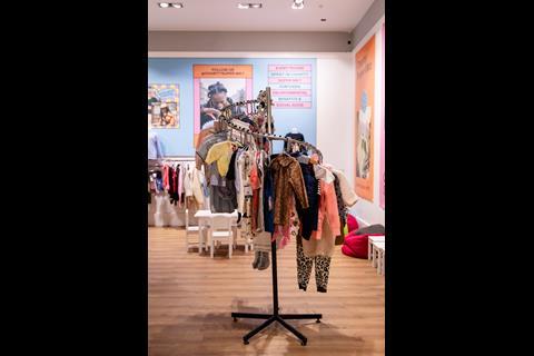Interior of Charity Super.Mkt store in Bluewater shopping centre, showing childrenswear on display